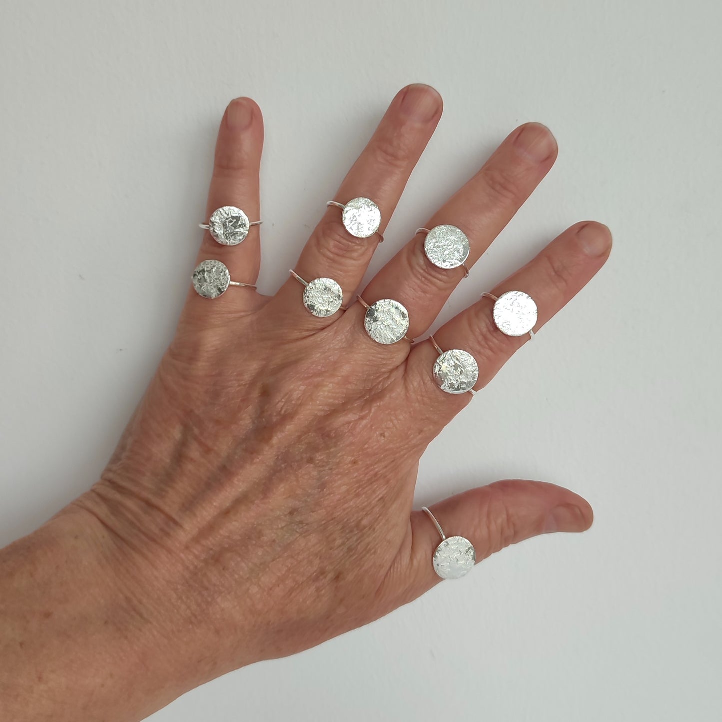 Small round silver rings. Minimal and made by hand