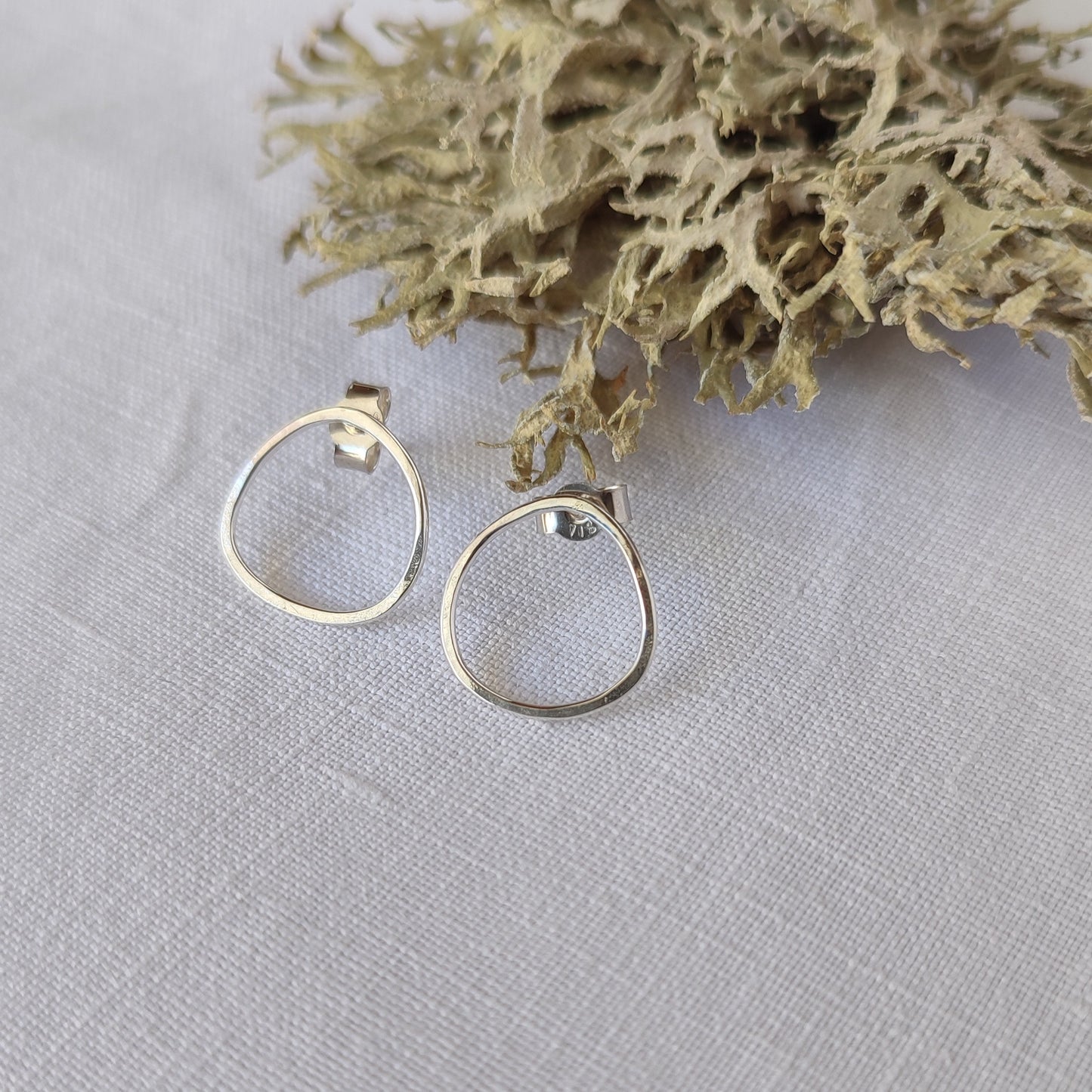 Small asymmetric earrings