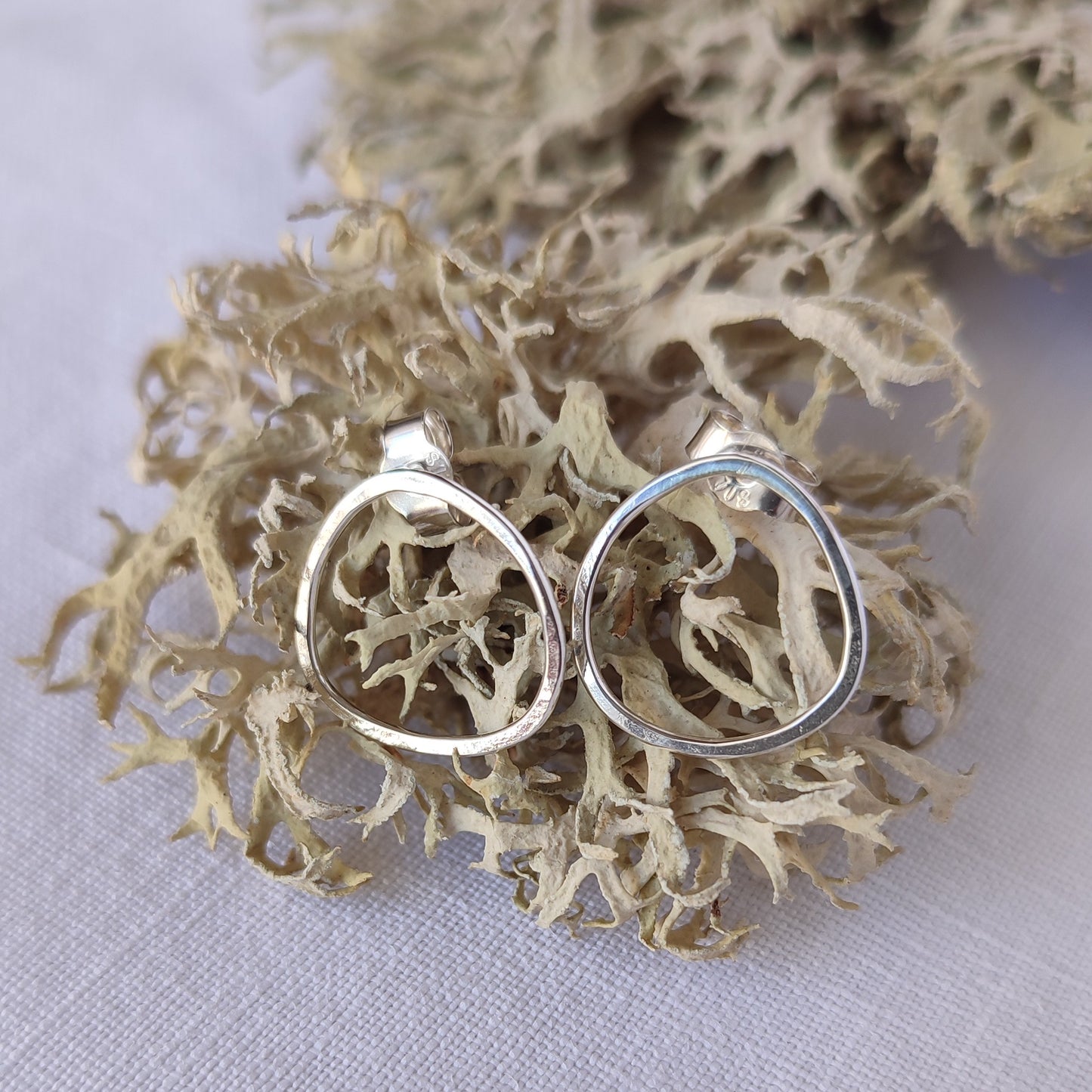 Small asymmetric earrings