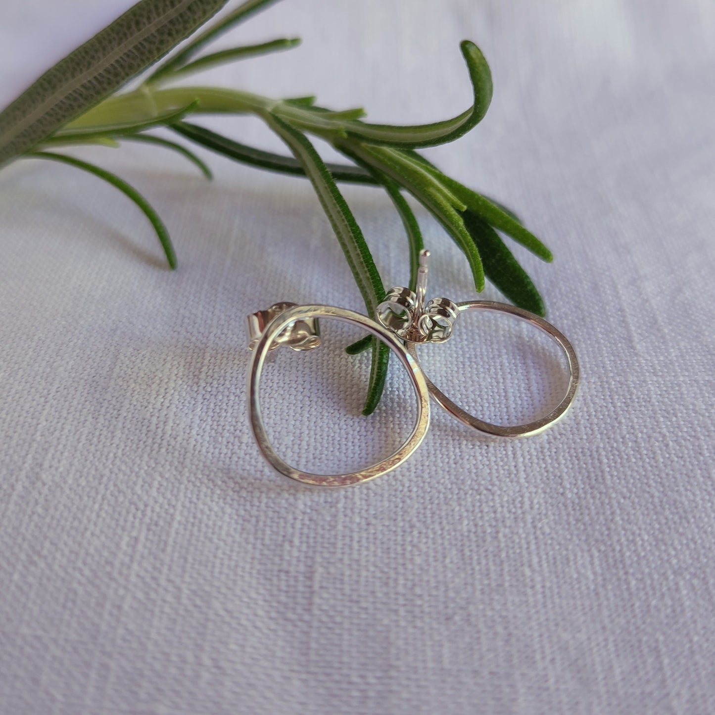 Small asymmetric earrings