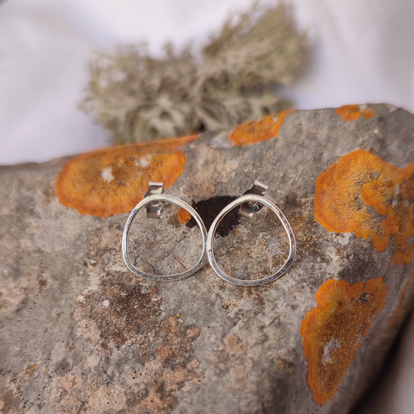 Small asymmetric earrings