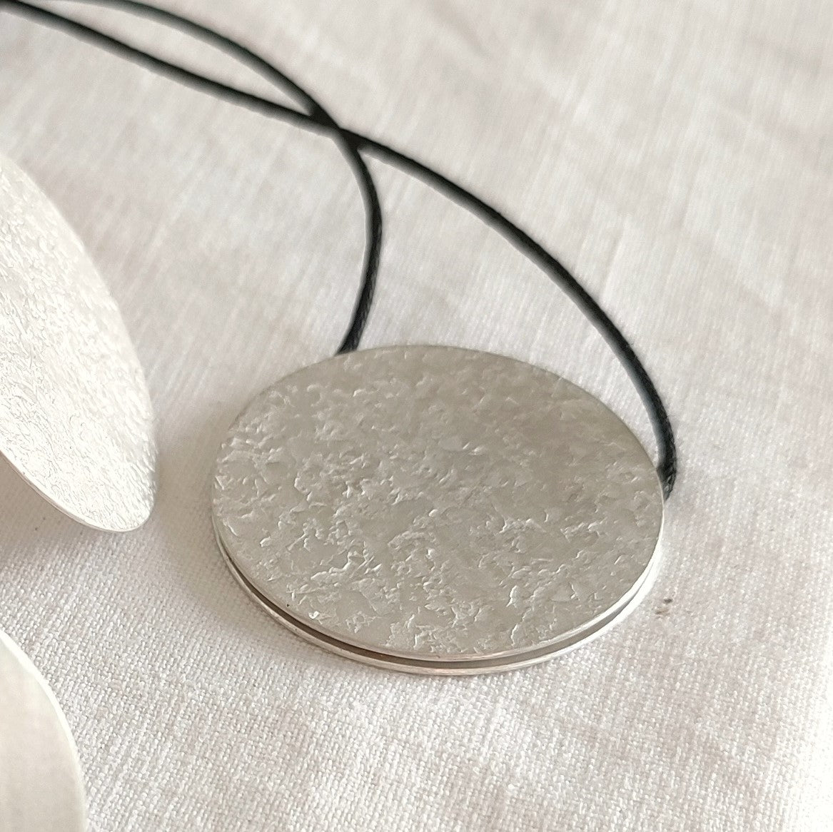 MOVE - Double Face Round Pendant