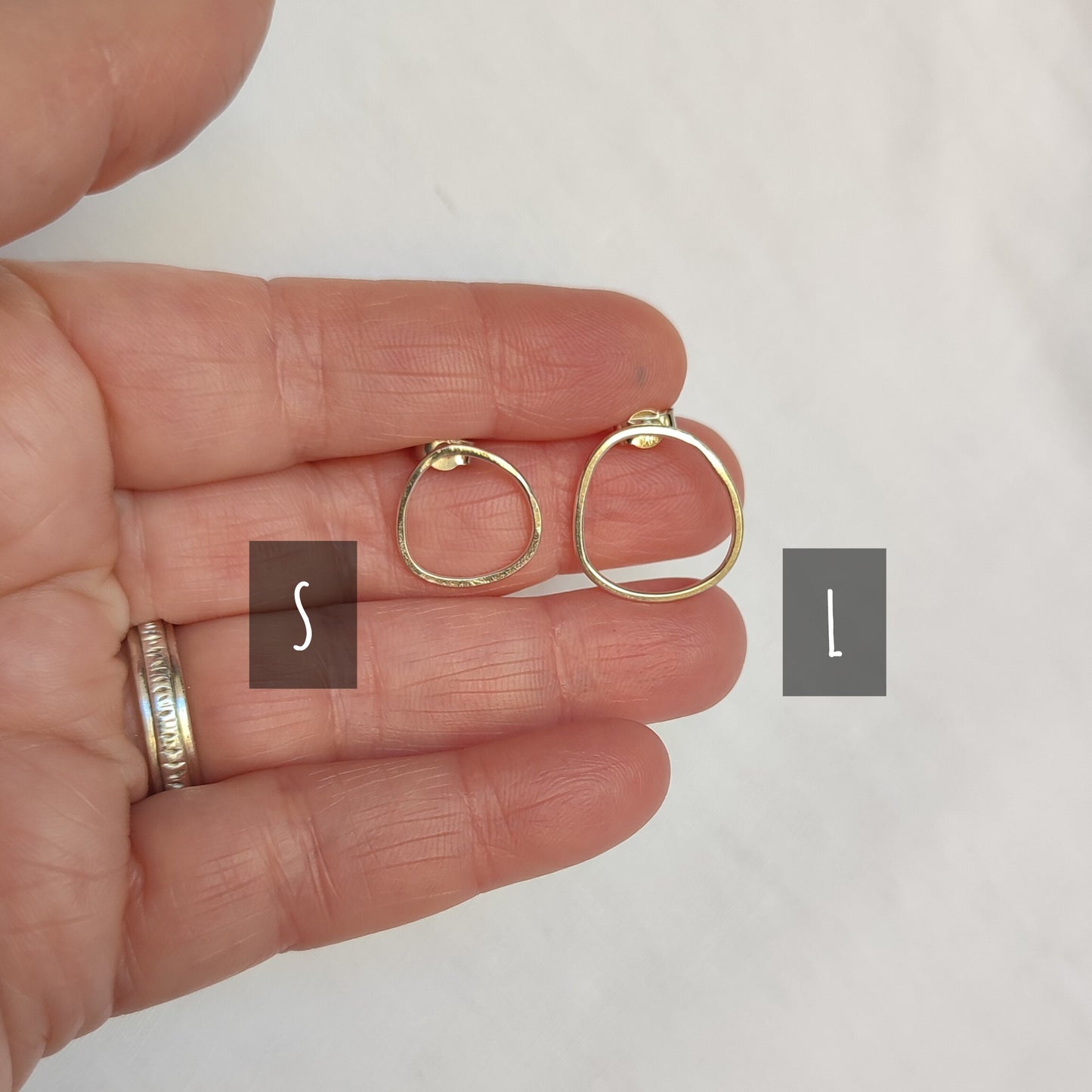 Small asymmetric earrings