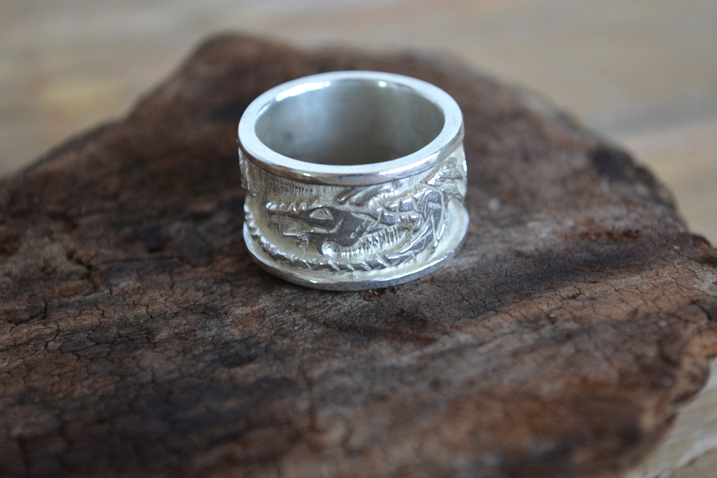 Silver ring with dragon. Band