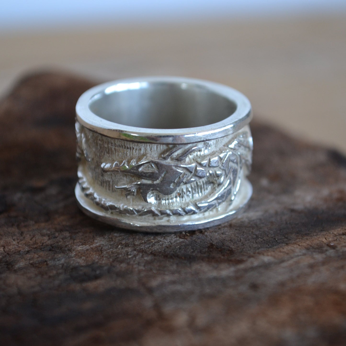 Silver ring with dragon. Band