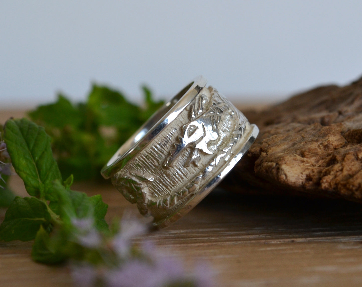 Silver ring with dragon. Band