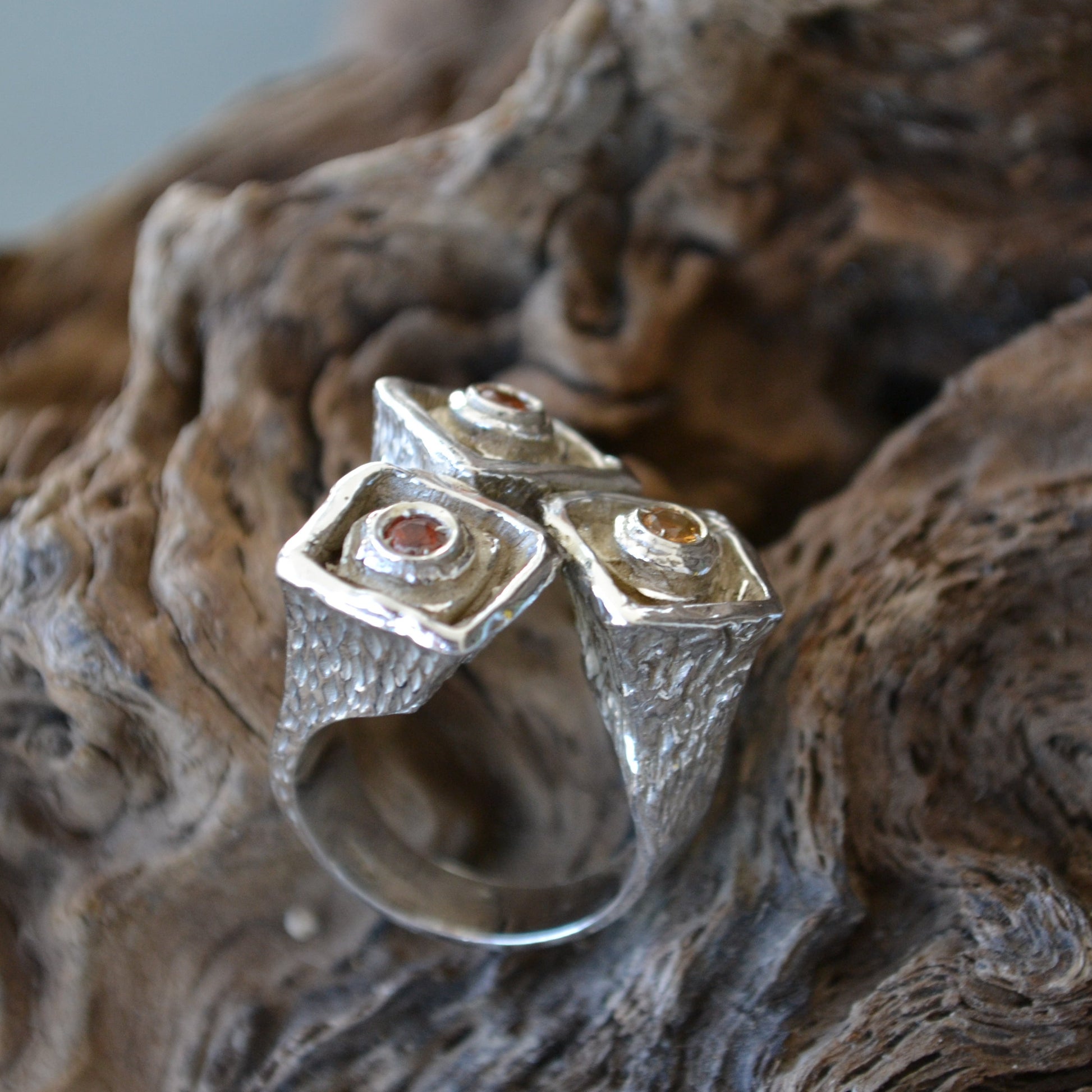 Recycled silver ring with orange-yellow sapphires