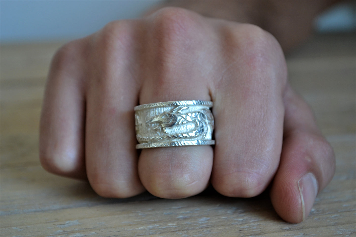 Silver ring with dragon. Band