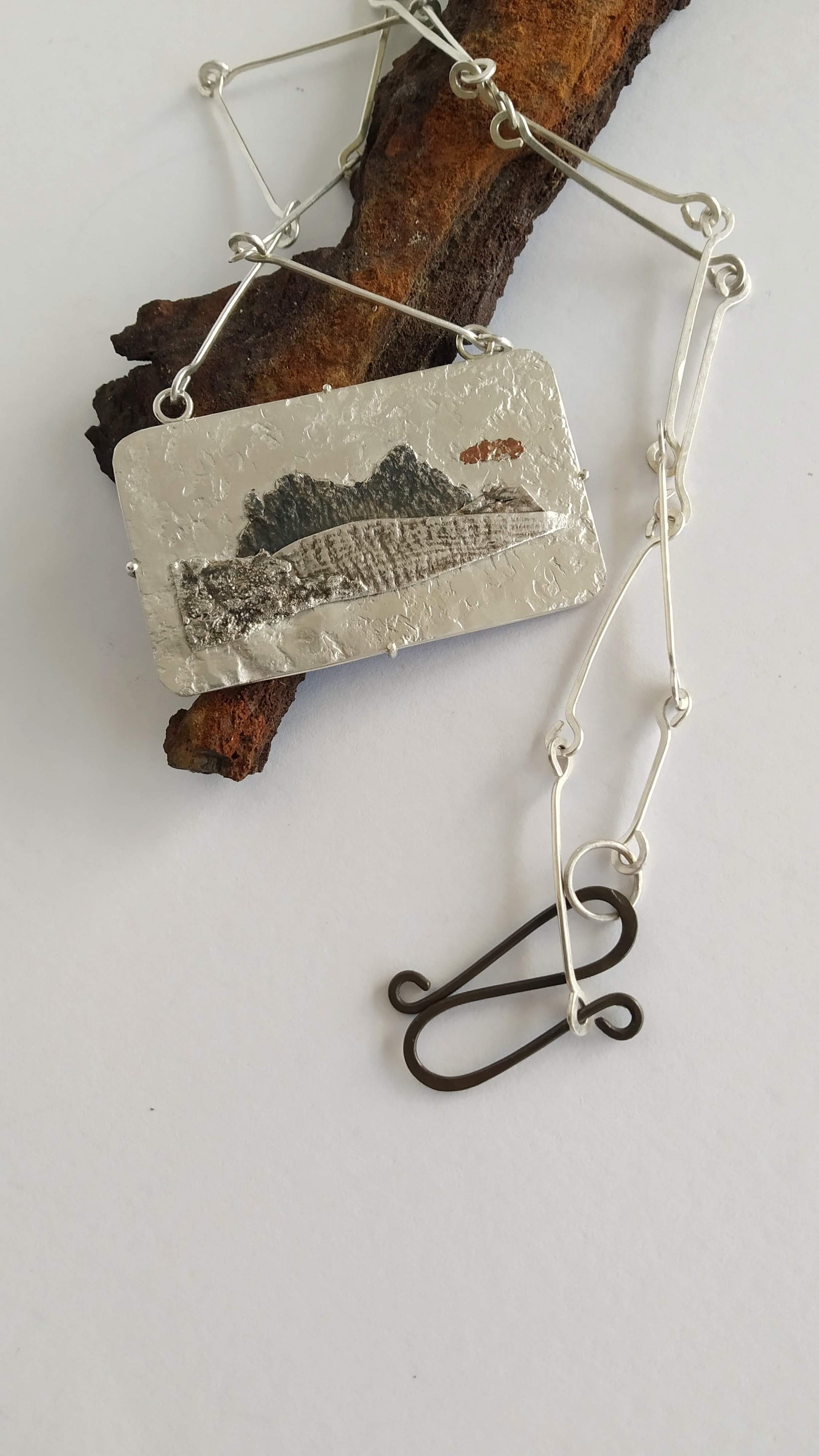 Silver  and copper pendant  with handmade chain representing a mountain, silver handmade chain and oxidized silver clasp